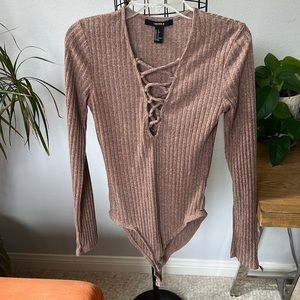 Brown fitted long sleeve, bodysuit with lace up front and snap bottom size small